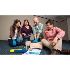 Students practising CPR on a training manikin — official PADI Emergency First Response Primary and Secondary Care course photograph
