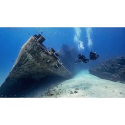 Scuba divers diving next to a wreck — official PADI Wreck Diver course image