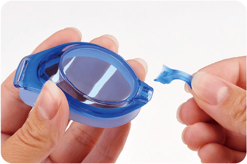 Manufacturer illustration showing a blue VIEW junior lens and nose bridge before assembly